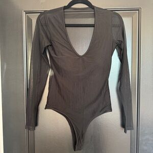 Klassy Network. Mesh black bodysuit with built in bra.